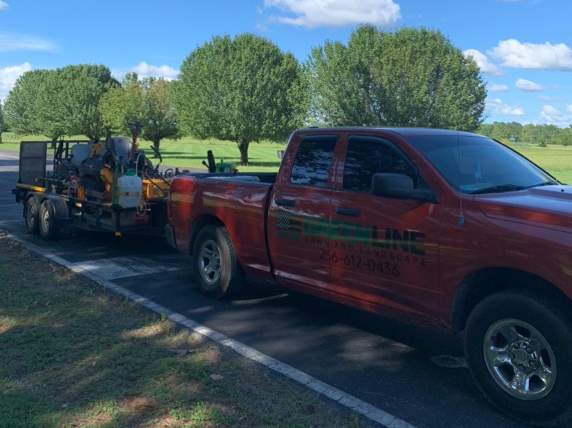 to show lawn equipment and greenline logo on truck